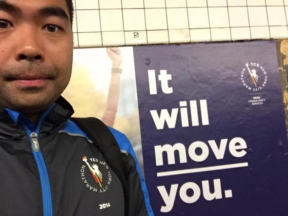 Selfie in front of an ad for the 2017 NYC Marathon